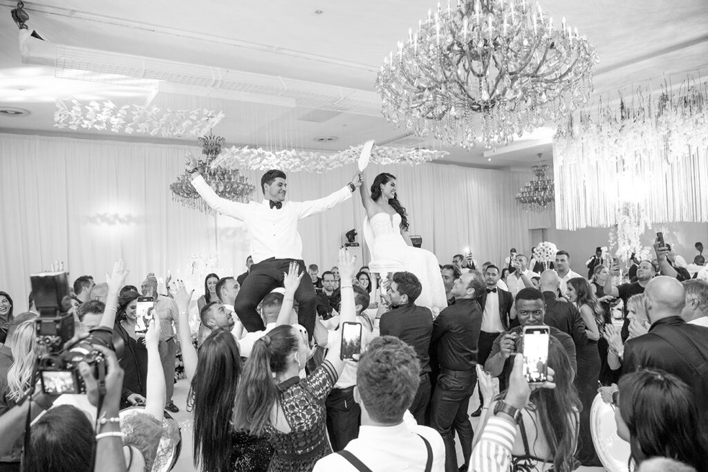 Candid moment black and white for K&M wedding reception at Fairlawns Boutique Hotel. Wedding photography by Kevin Mark Pass , bridal makeup by Storm Pass